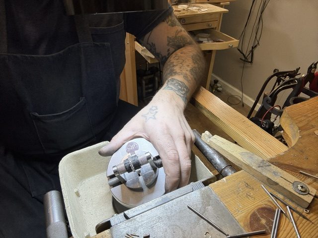 Laevi working at his jewelry bench